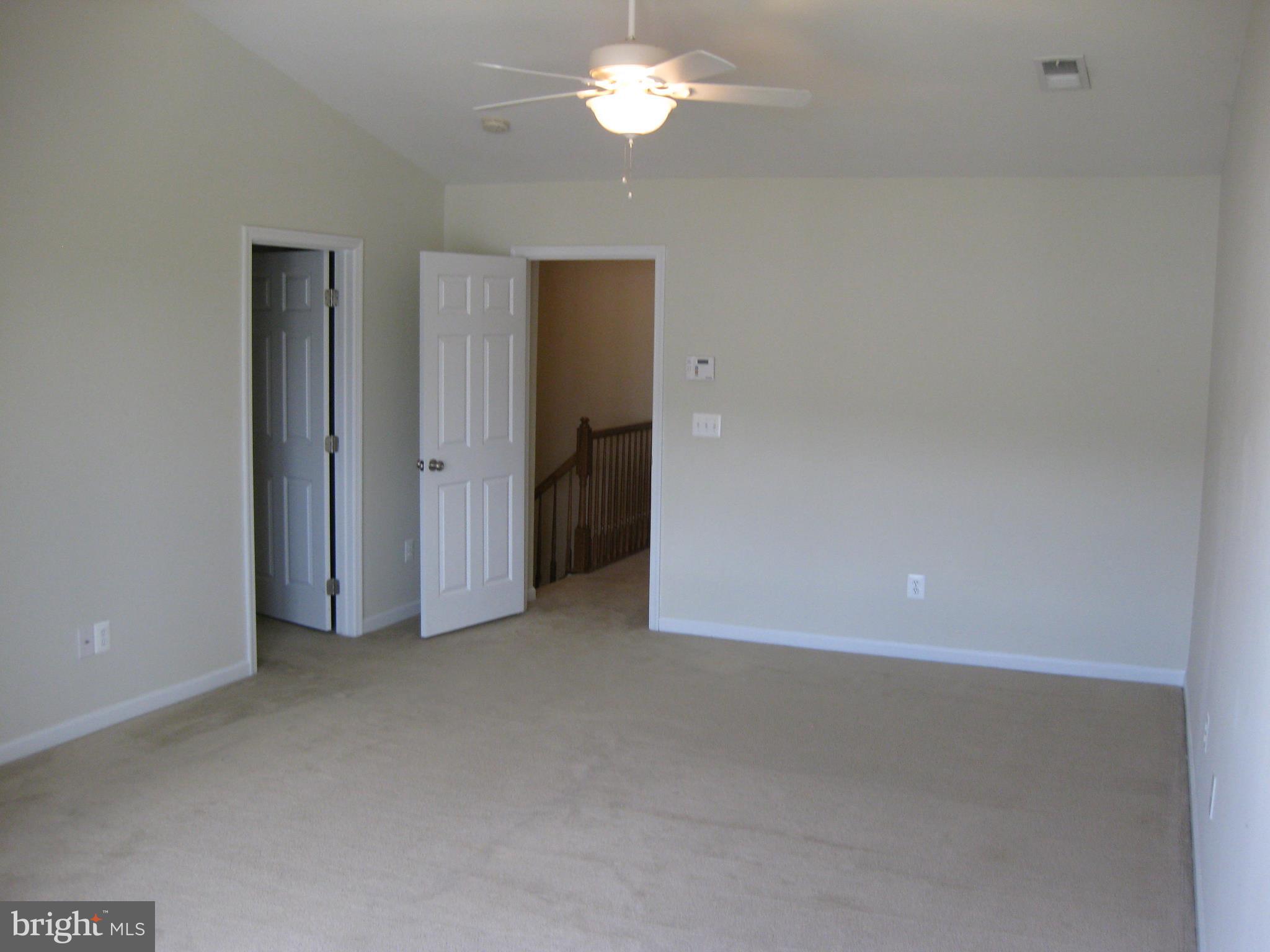 1252 Steed Street Ranson, WV 25438 - Photo 25 of 36 a view of empty room with a ceiling fan