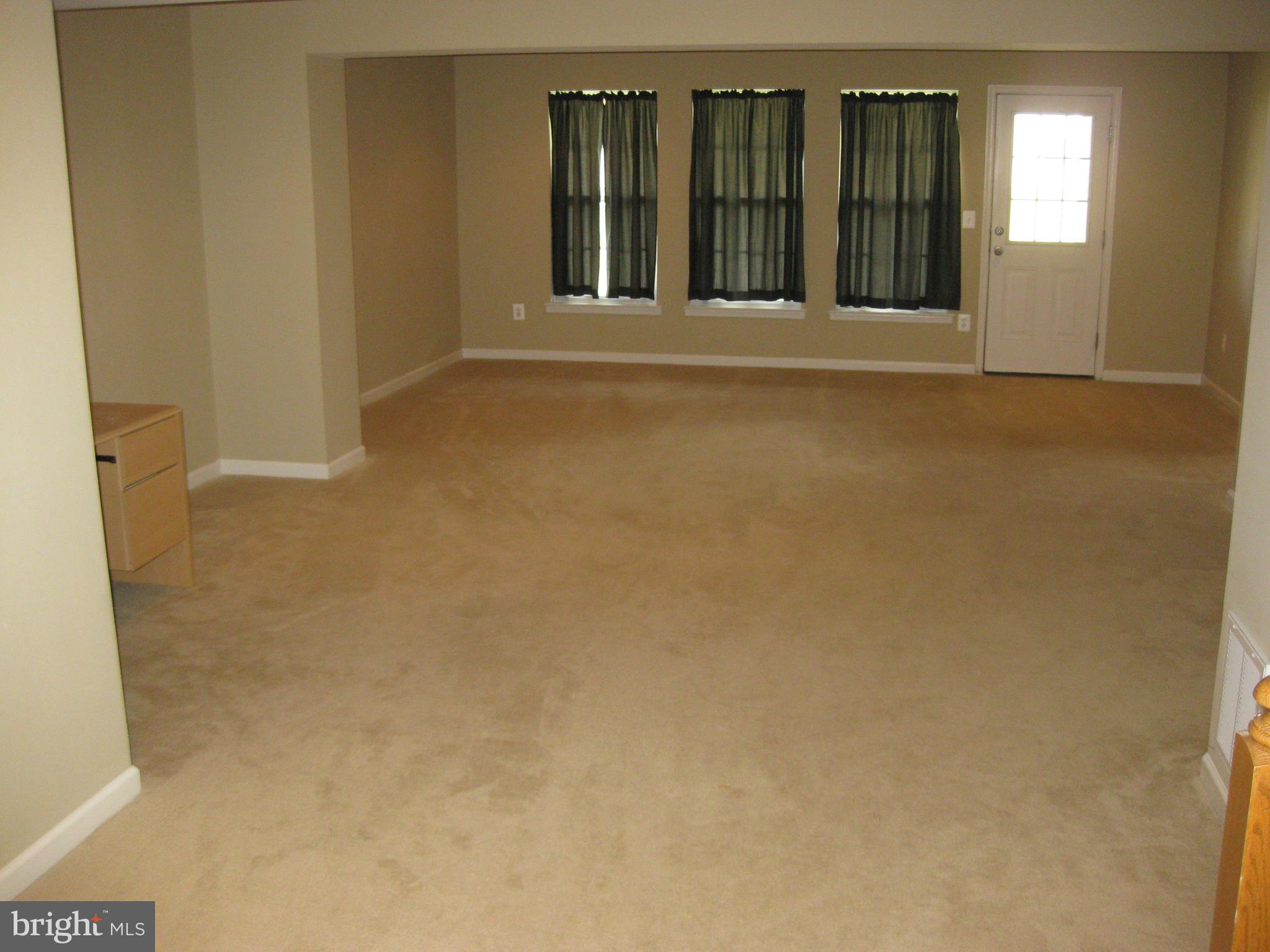 1252 Steed Street Ranson, WV 25438 - Photo 31 of 36 a view of an empty room with wooden floor
