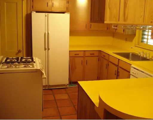 a view of hallway with wooden floor