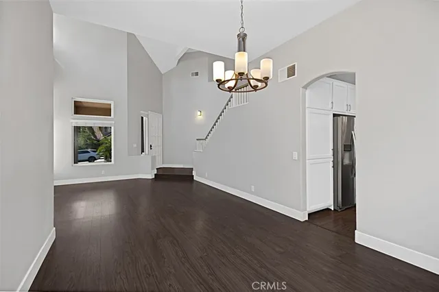 a kitchen with kitchen island a counter top space stainless steel appliances and cabinets