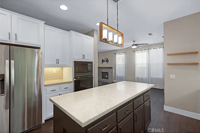 a kitchen with a sink a stove and refrigerator