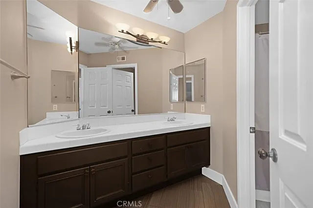 a bathroom with a sink a vanity and a mirror
