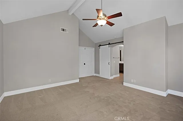 a spacious bathroom with a double vanity sink and a mirror