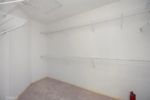 a view of a bench in a backyard of a house