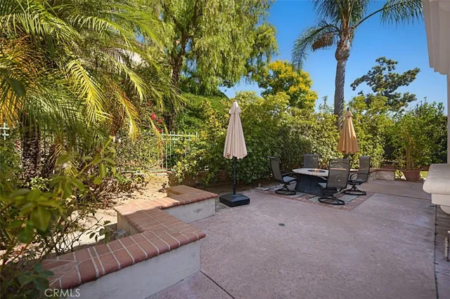a view of a patio with a table and chairs