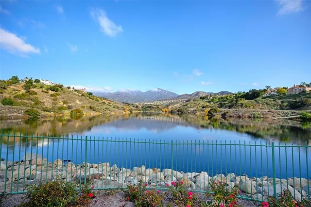 a view of residential houses with a lake view
