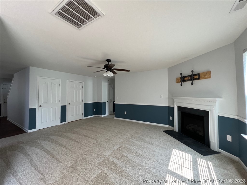 251 Botanical Court Bunnlevel, NC 28323 - Photo 3 of 20 a bedroom with a bed and a fireplace