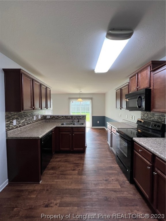 251 Botanical Court Bunnlevel, NC 28323 - Photo 6 of 20 a large kitchen with stainless steel appliances wooden cabinets and a stove top oven