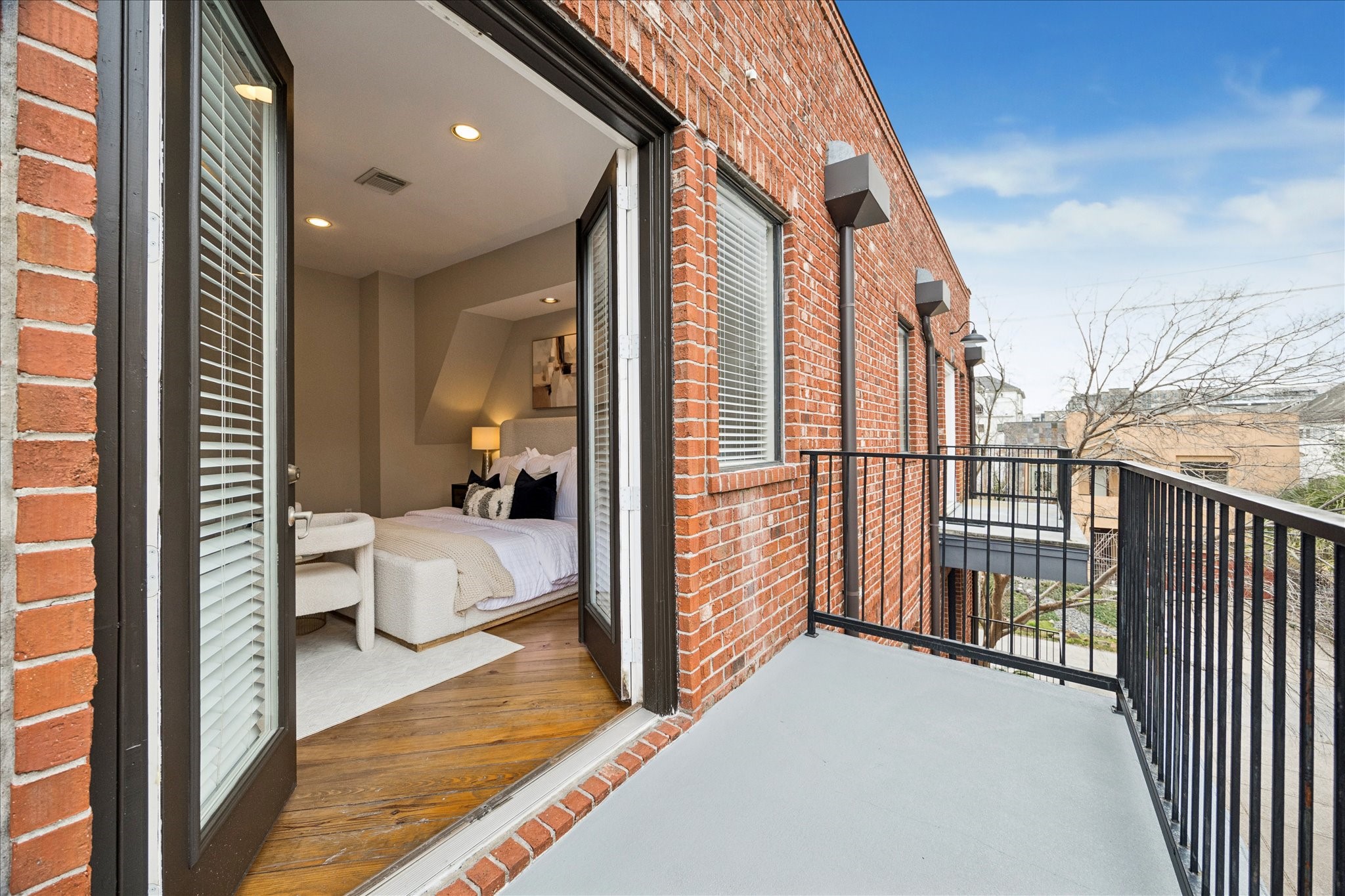 910 Malone Street, Unit 104 Houston, TX 77007 - Photo 29 of 44 Large balcony, recently painted, with French doors