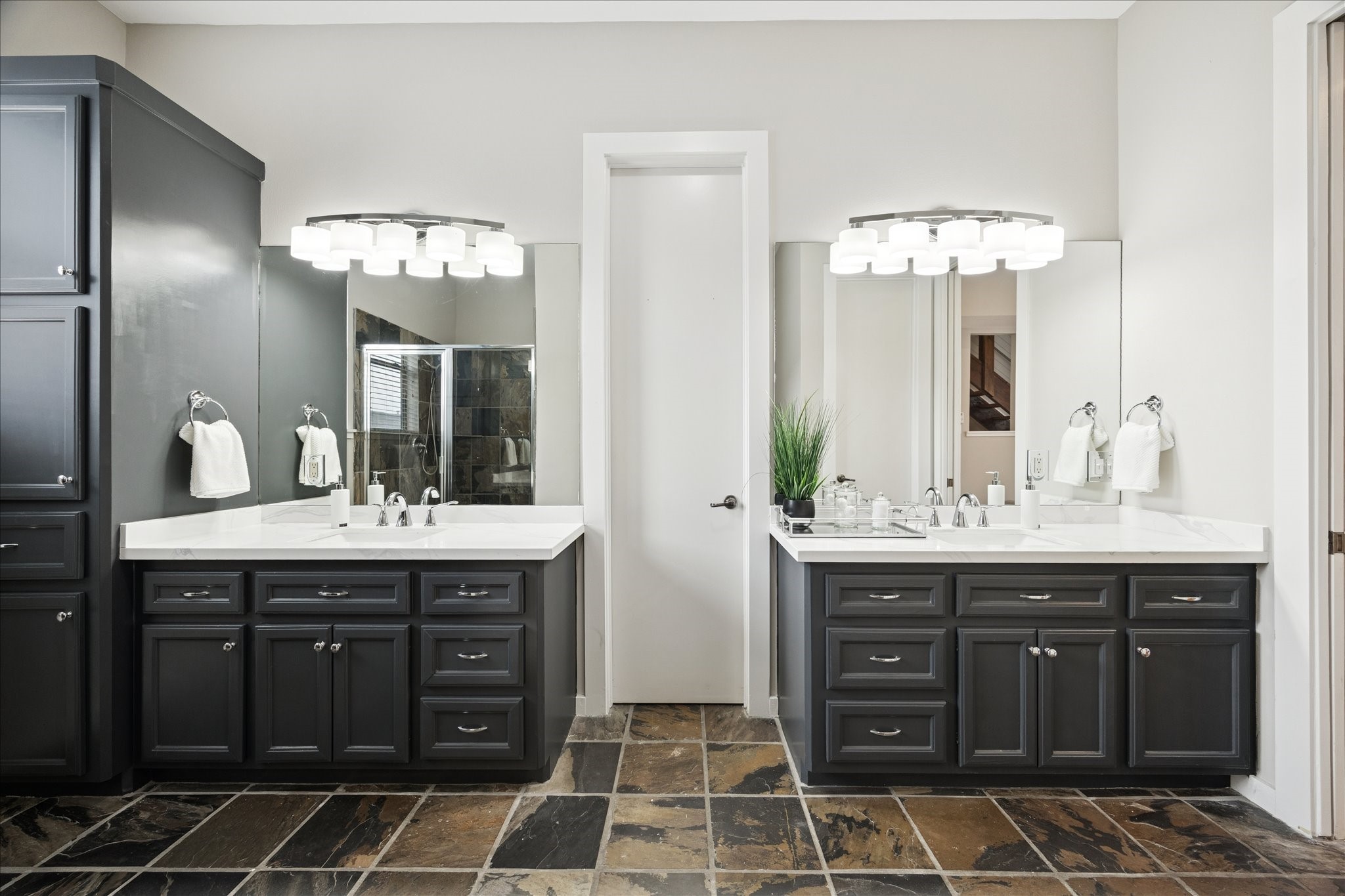 910 Malone Street, Unit 104 Houston, TX 77007 - Photo 31 of 44 Primary Bath with double sinks, designer lighting, and elegant slate flooring