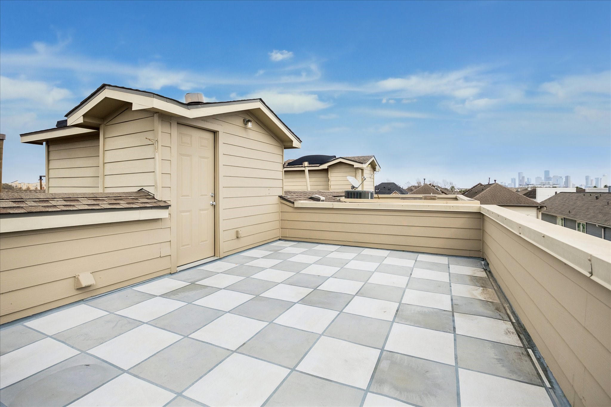 910 Malone Street, Unit 104 Houston, TX 77007 - Photo 42 of 44 Alternate view of rooftop terrace, with new door and freshly painted cement board siding