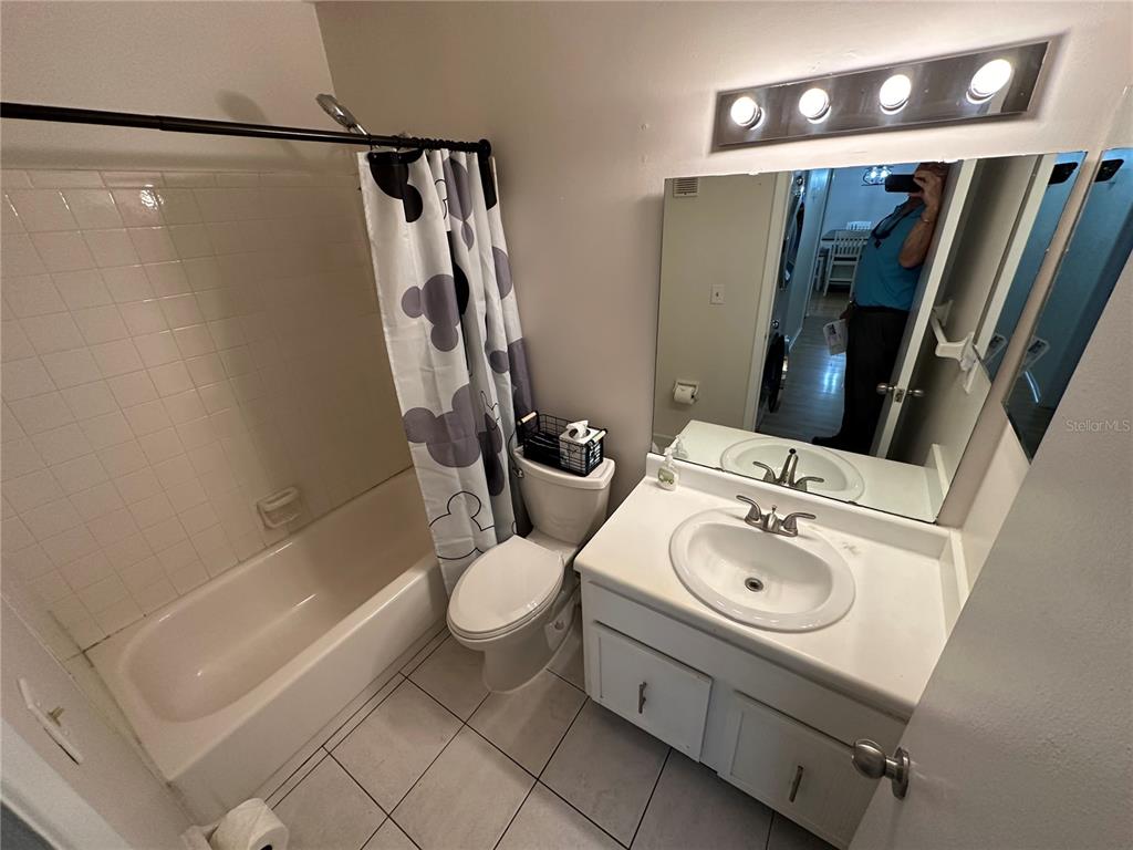 7429 Daniel Webster Drive, Unit 14 (#C) Winter Park, FL 32792 - Photo 12 of 15 a bathroom with a sink toilet and shower