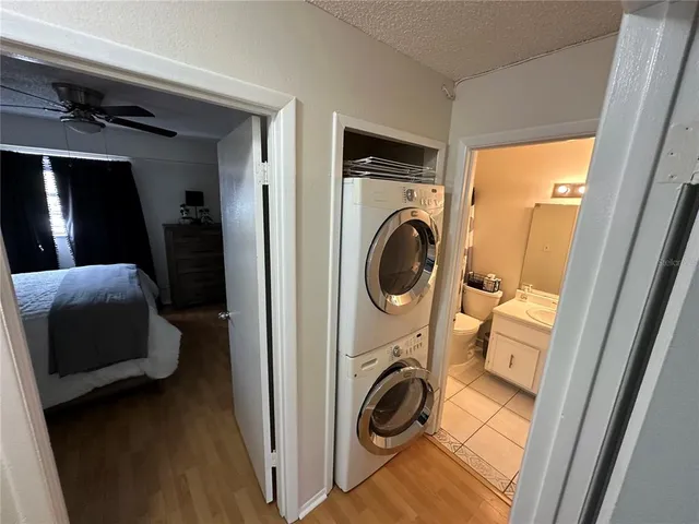 a view of a bedroom with washer and dryer