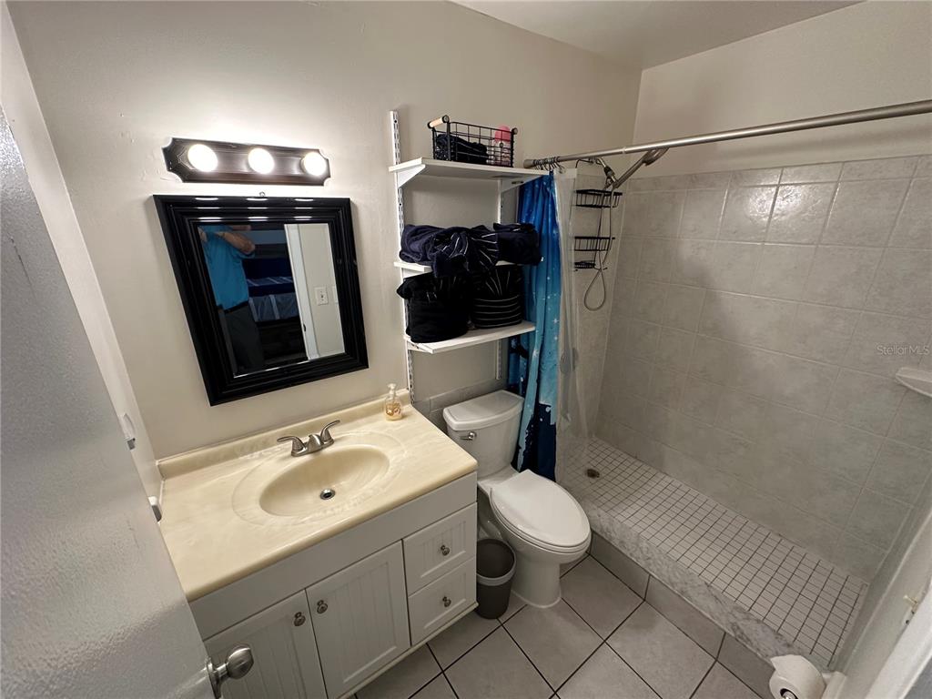 7429 Daniel Webster Drive, Unit 14 (#C) Winter Park, FL 32792 - Photo 10 of 15 a bathroom with a sink toilet and shower