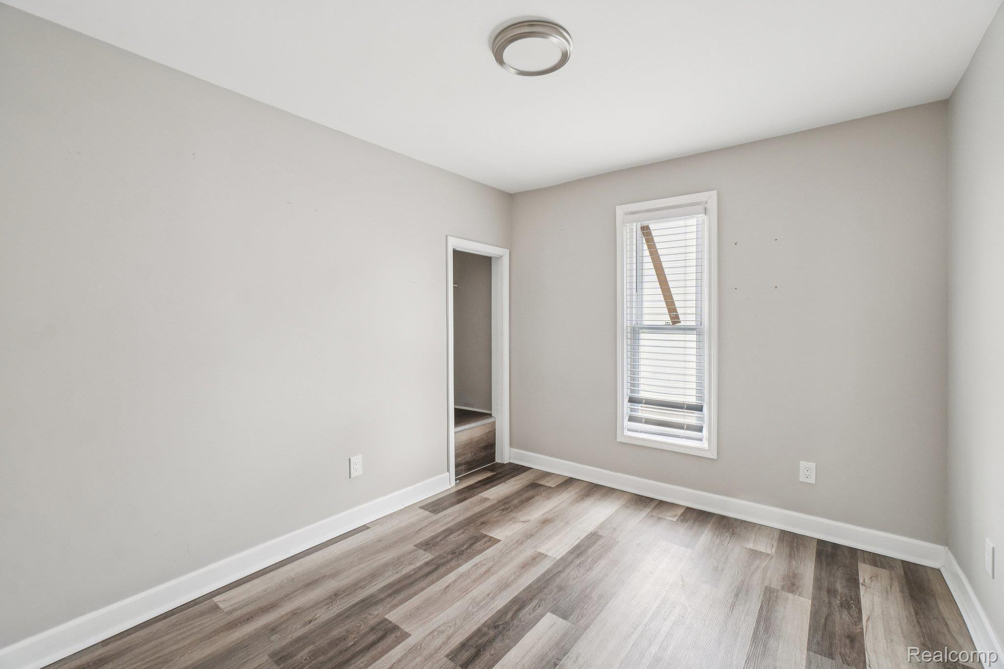 3822 Wabash Street Detroit, MI 48208 - Photo 12 of 17 Empty room featuring light wood-type flooring and baseboards