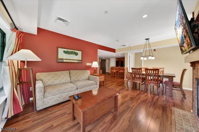 a spacious bathroom with a bathtub sink mirror and toilet