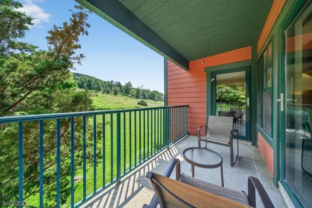 a view of a field with an trees
