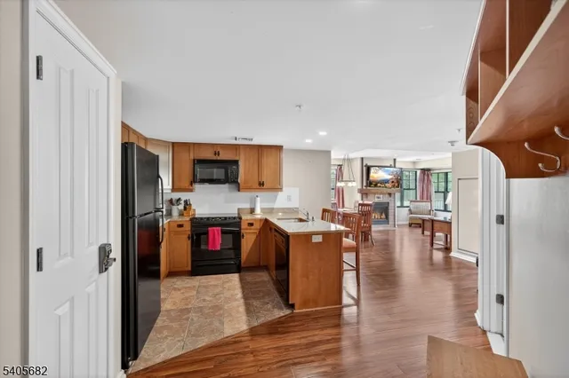 a view of hallway with wooden floor