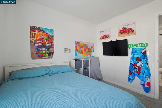 a bathroom with a sink a toilet and shower curtain