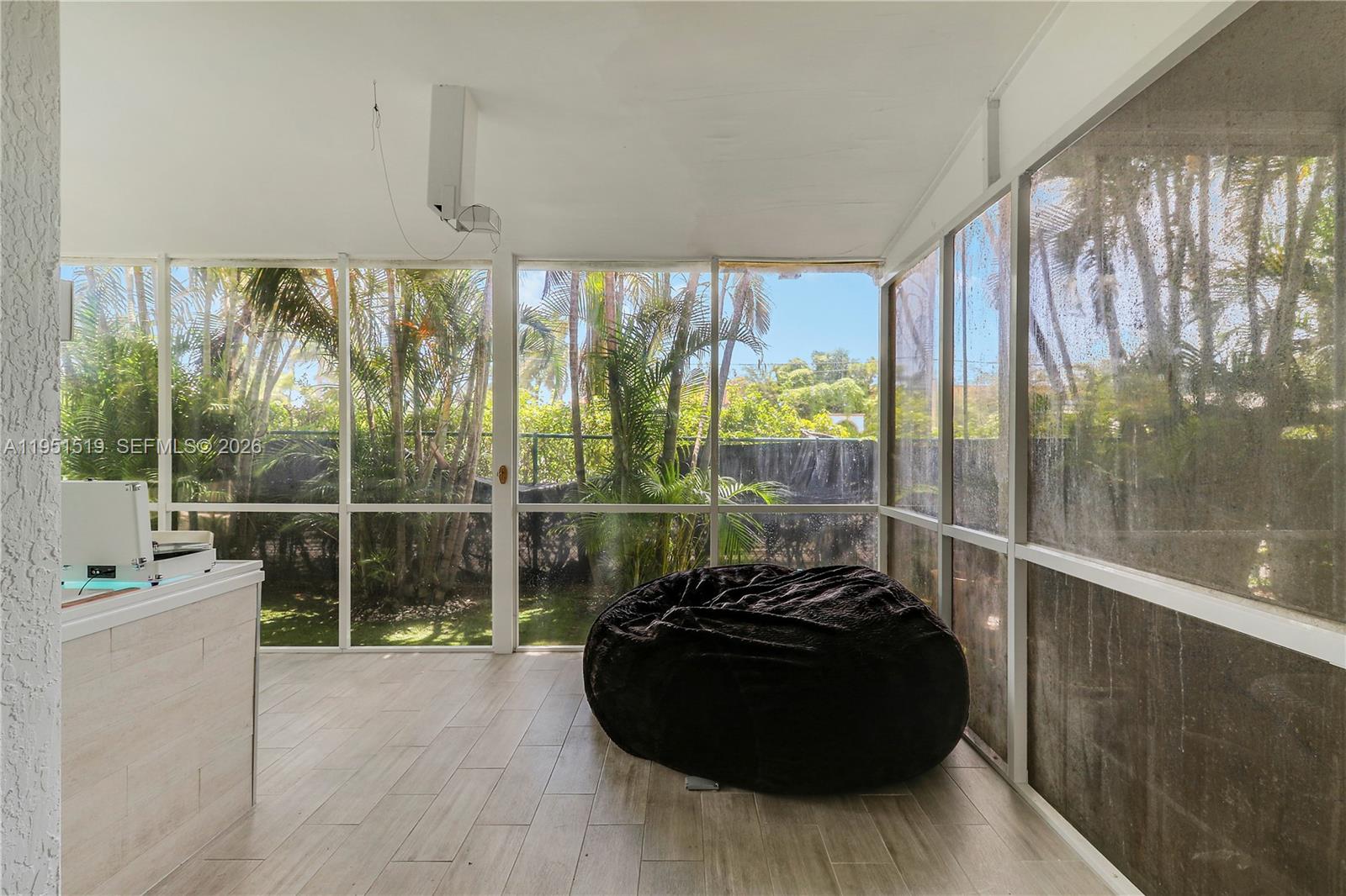 6047 Seminole Gardens Circle Riviera Beach, FL 33418 - Photo 17 of 40 a room with a large window and walk in closet