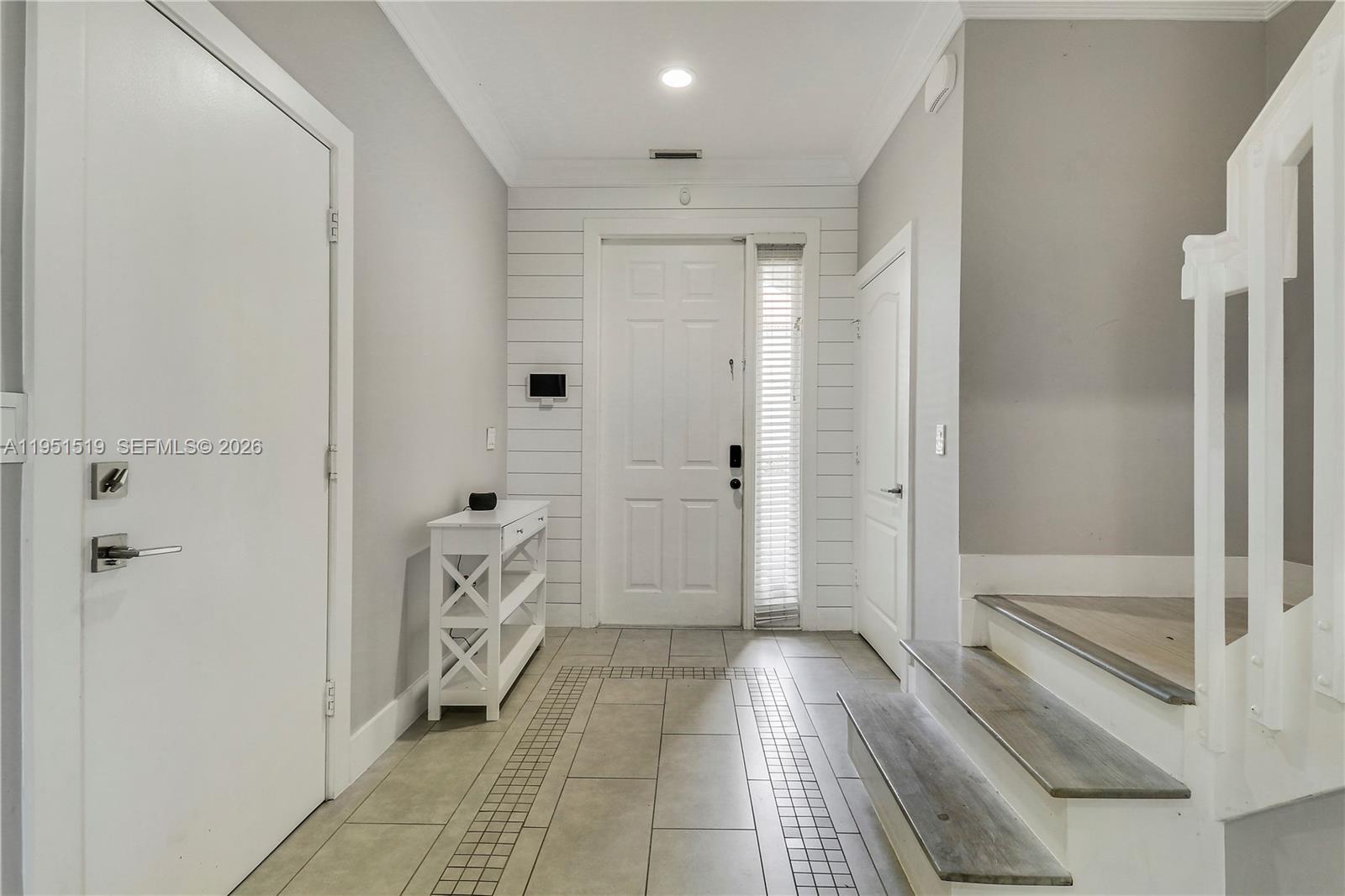 6047 Seminole Gardens Circle Riviera Beach, FL 33418 - Photo 20 of 40 a bathroom with a shower and a tub