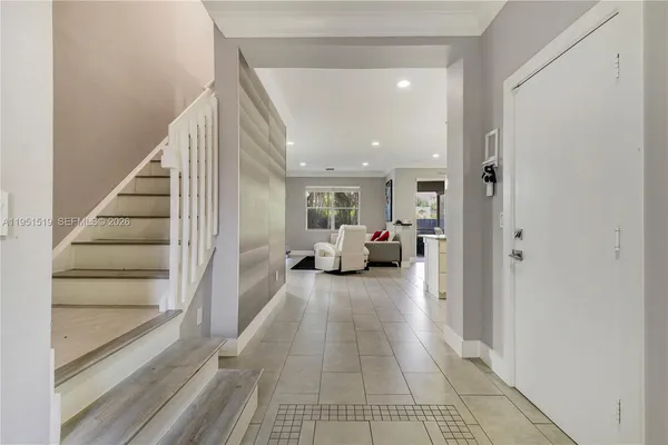 a view of a living room and a livingroom with furniture