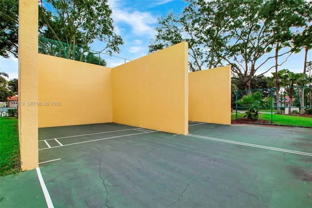 a view of a house with a big yard and sitting area