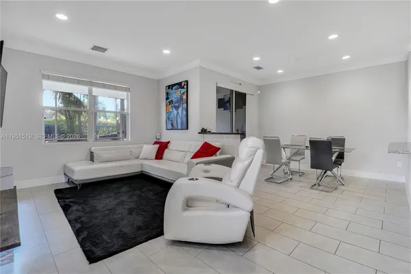 a living room with furniture and a window