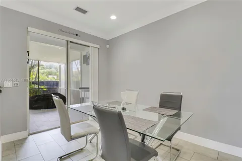 a view of a workspace with furniture and a potted plant
