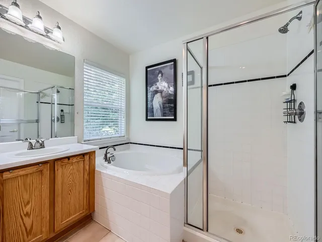 a bathroom with a tub and a sink
