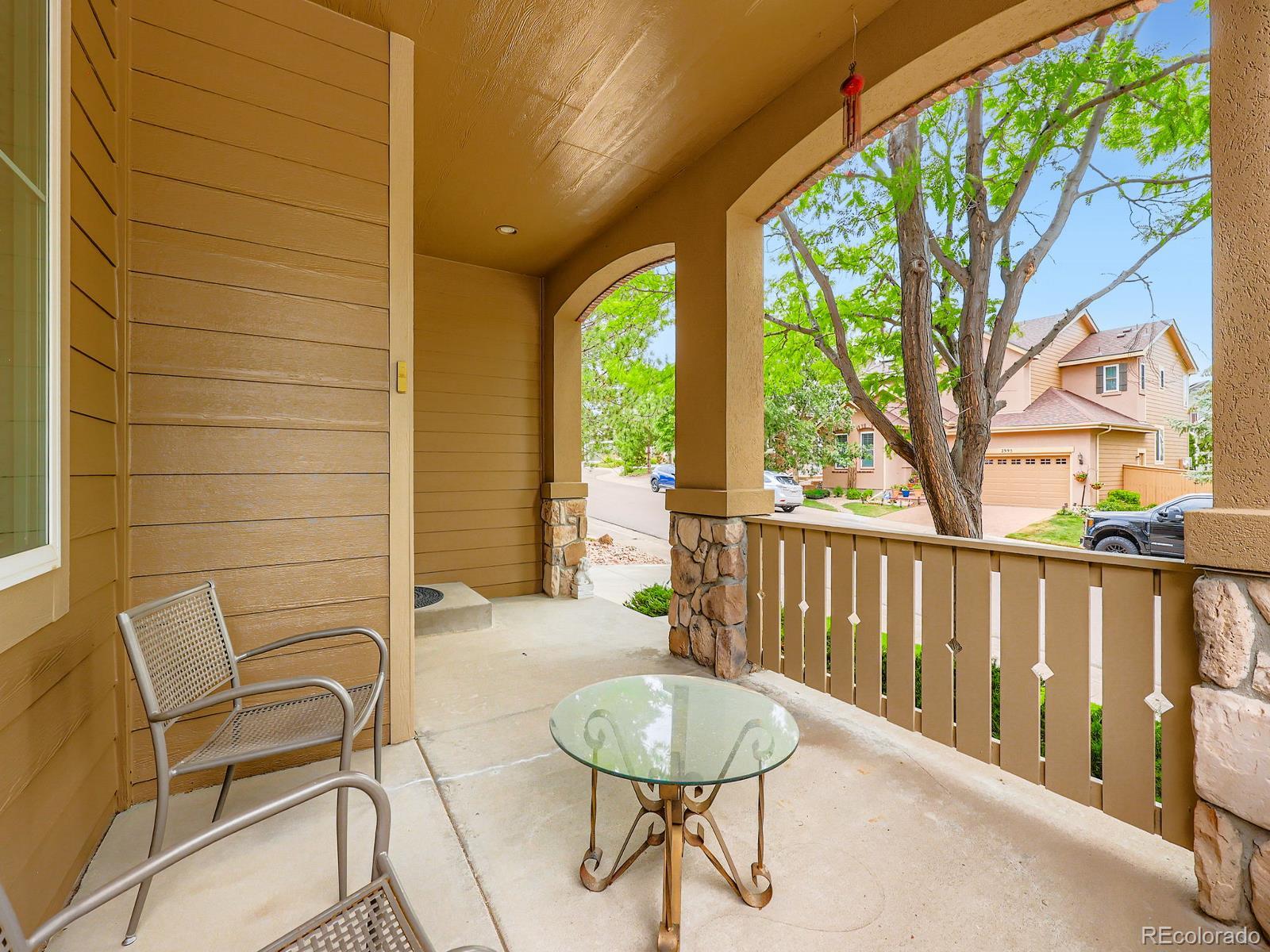 3000 Fox Sedge Lane Highlands Ranch, CO 80126 - Photo 24 of 33 a balcony with table and chairs