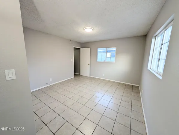 a room with gym equipment and a window