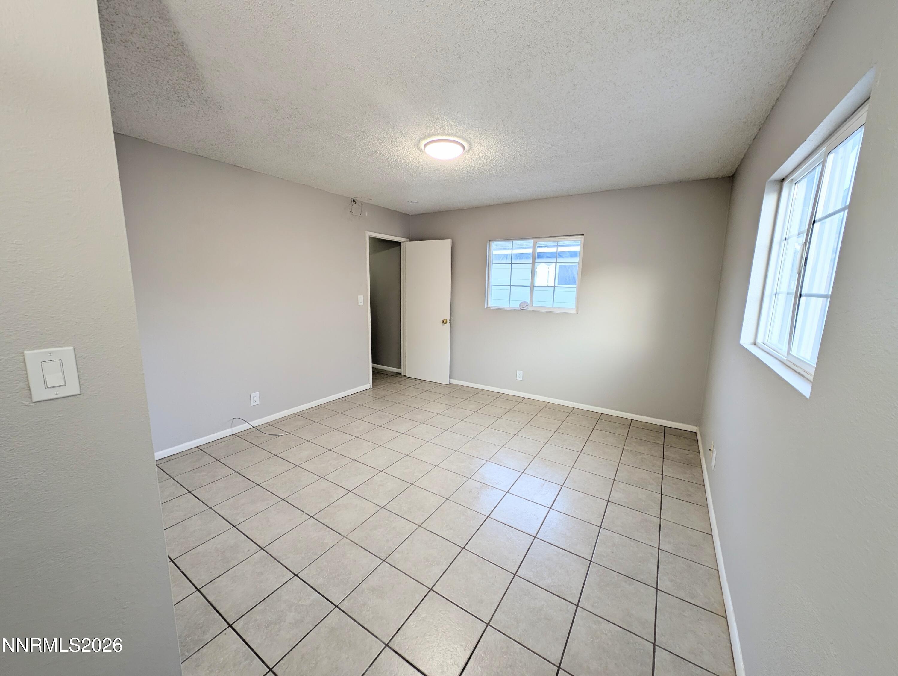 367 Connelly Street Hawthorne, NV 89415 - Photo 24 of 32 a view of an empty room and window