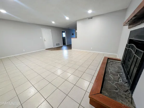 a utility room with cabinets washer and dryer