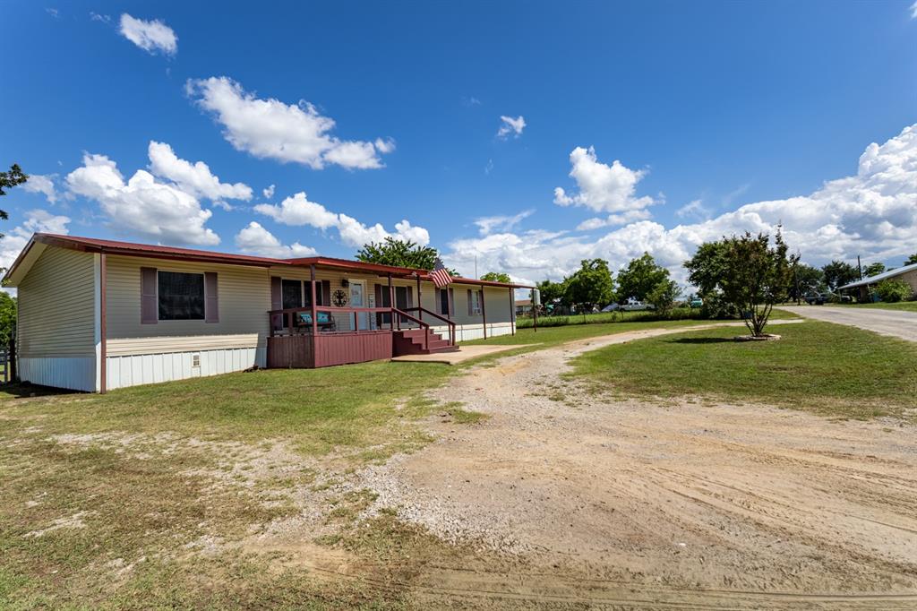 75 Southern Road Mineral Wells, TX 76067 - Photo 3 of 31 a view of a house with a big yard
