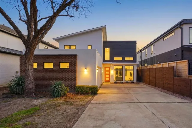 a view of a room with wooden floor and a window