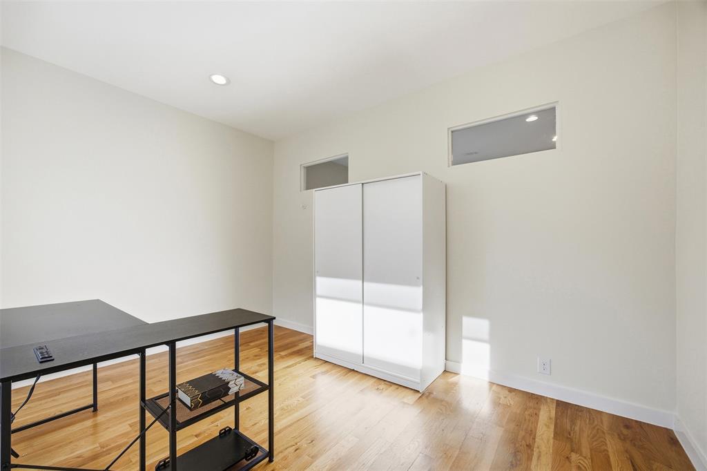 5326 Manett Street Dallas, TX 75206 - Photo 12 of 36 a view of a room with wooden floor and a window