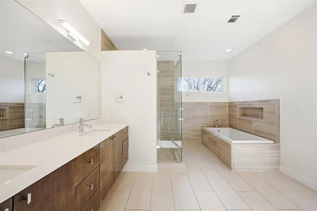 a bathroom with a shower and a sink