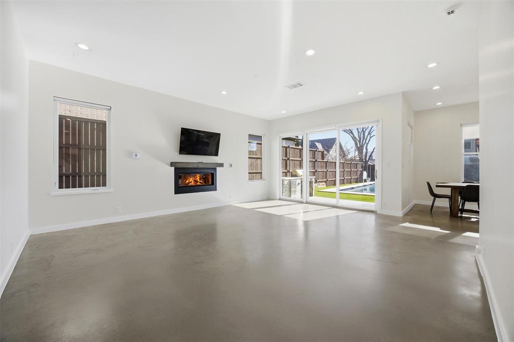 5326 Manett Street Dallas, TX 75206 - Photo 2 of 36 a view of an empty room with window and wooden floor