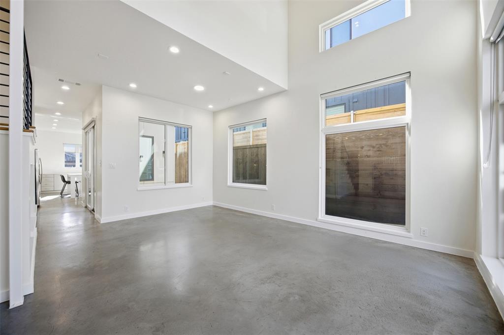 5326 Manett Street Dallas, TX 75206 - Photo 22 of 36 a view of an empty room with a window and wooden floor