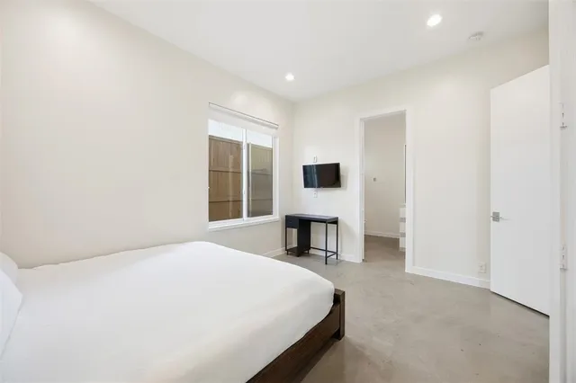 a bathroom with a double vanity sink toilet a shower and a mirror