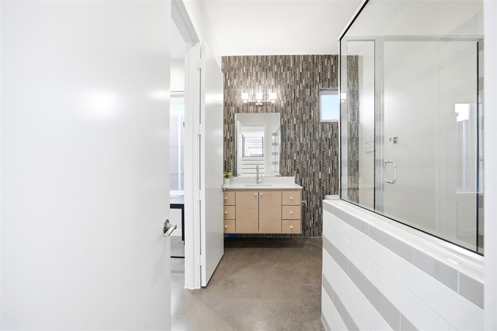 5326 Manett Street Dallas, TX 75206 - Photo 25 of 36 a bathroom with a double vanity sink toilet a shower and a mirror