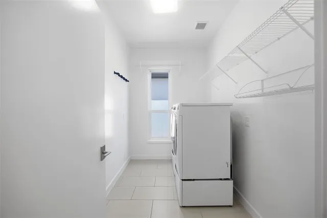 a kitchen with a table and chairs