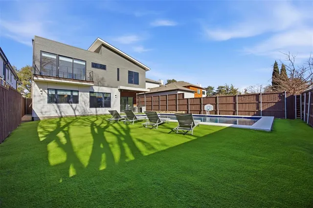 a view of a patio with table and chairs with wooden floor