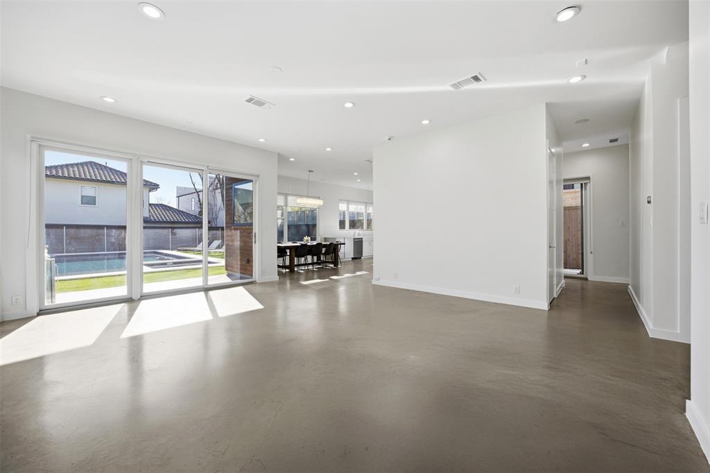 5326 Manett Street Dallas, TX 75206 - Photo 5 of 36 a view of empty room with wooden floor and fireplace