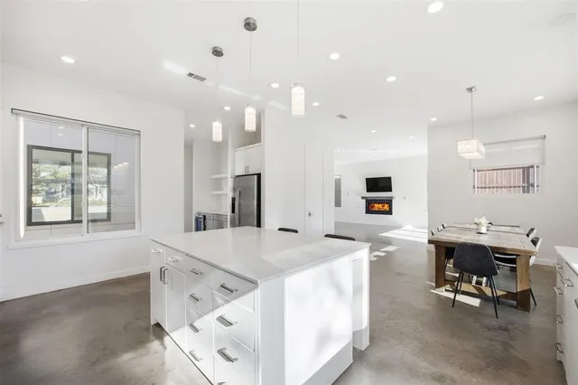 a kitchen with counter top space cabinets and stainless steel appliances
