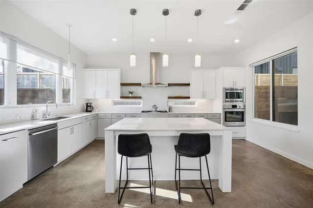 a front view of a building with a yard