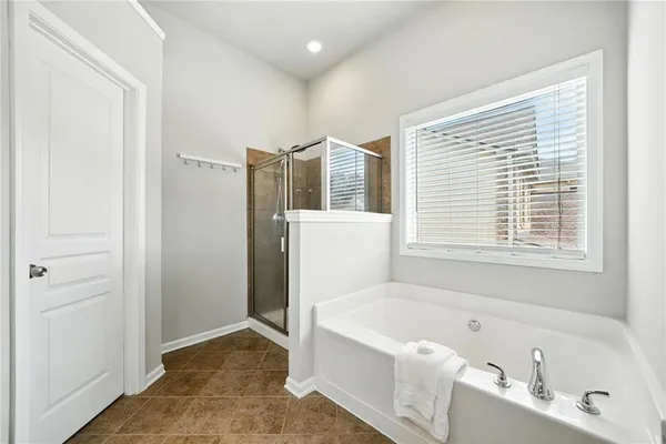 a bathroom with a bathtub a toilet and a sink