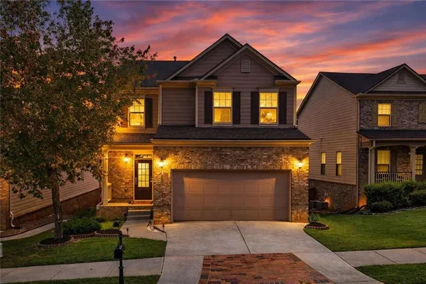 a front view of a house with garden