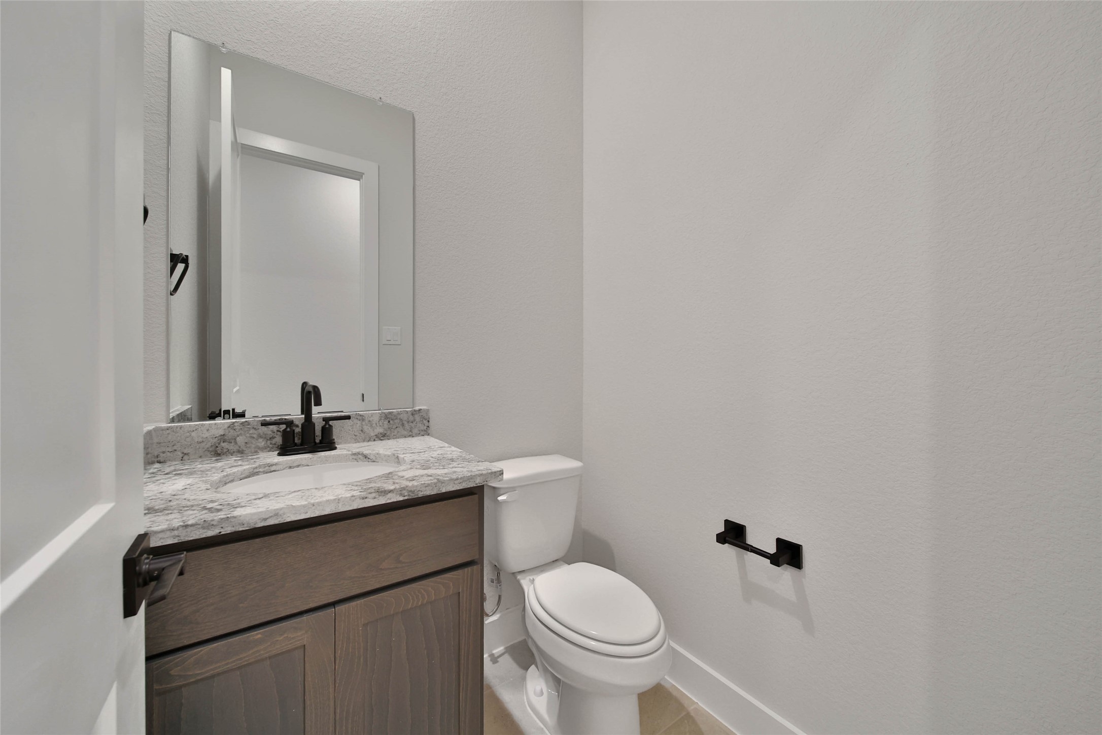 4610 Magnolia Bend Drive Rosharon, TX 77583 - Photo 38 of 48 a bathroom with a granite countertop sink toilet and mirror
